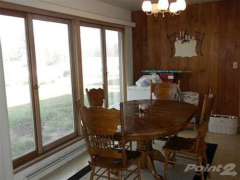 Great room/family room located adjacent to kitchen (currently being used as a dining room).