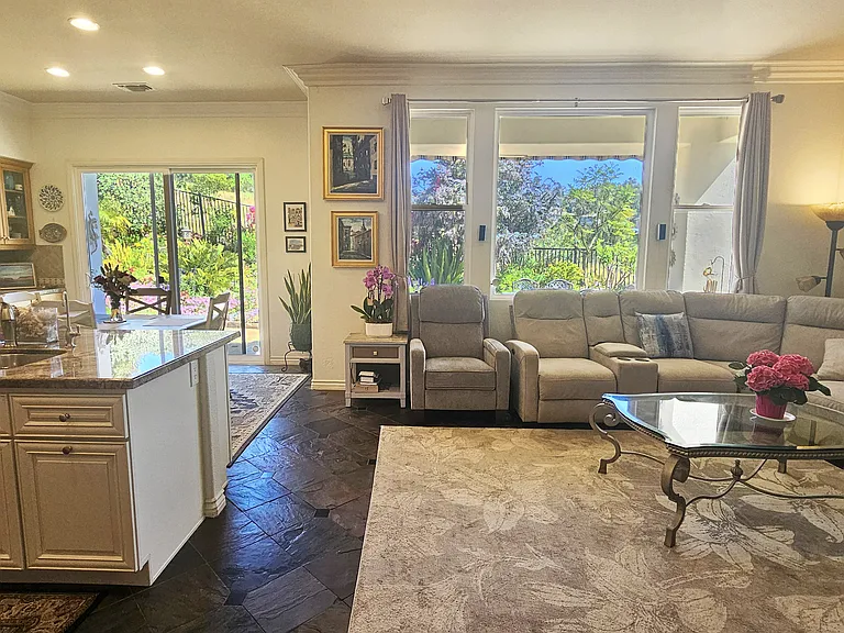 Remodeled kitchen and adjacent family room. Note: Sink has faucet for pure drinking water via 6-stage RO system! No need for bottled water.