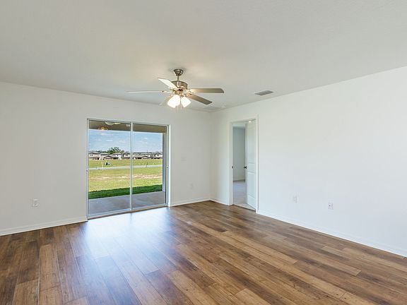 The family room is spacious with a sliding door to the back patio