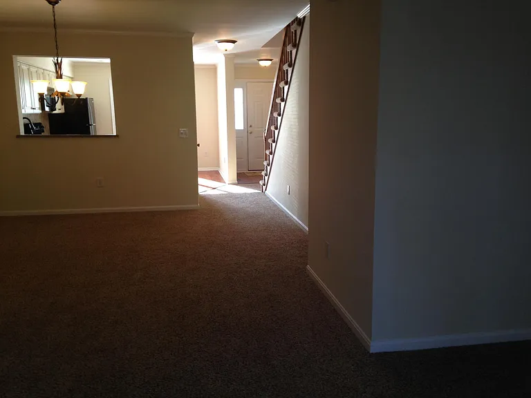 Living/Dining room area looking at Foyer entrance/kitchen