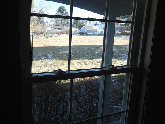 Covered porch and open area in front of unit.