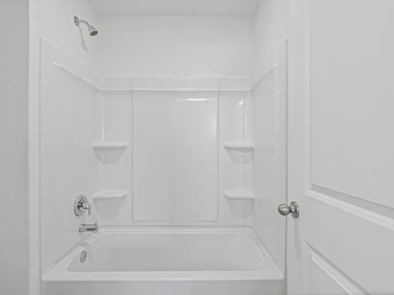 A shower/tub combination in the master bathroom.