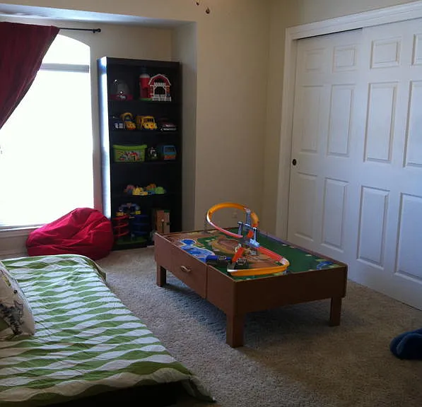 Second bedroom with southern exposure and slide door closet
