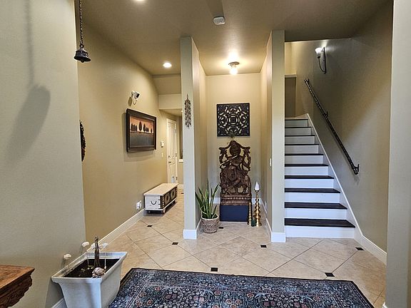 Spacious foyer with high ceiling.