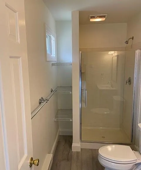 Bathroom with new shower, toilet, & shelves