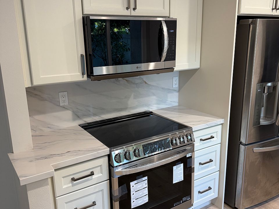 This photo is NOT from the unit for rent. It is from another unit recently renovated with similar materials.

The new kitchen in the unit for rent will look similar.