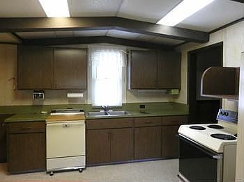 Kitchen includes electric range, refrigerator & built-in dishwasher