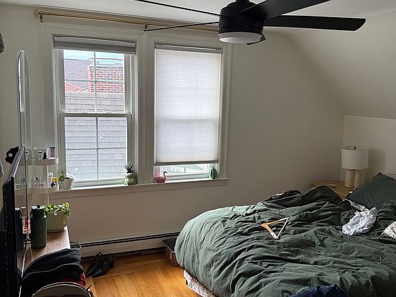 Spacious bedroom w remote controlled ceiling fan & dimmable light. walk in closet featured