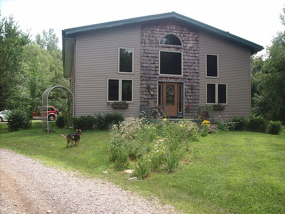 400 ft down a private lane, nestled in 4 acres of woods