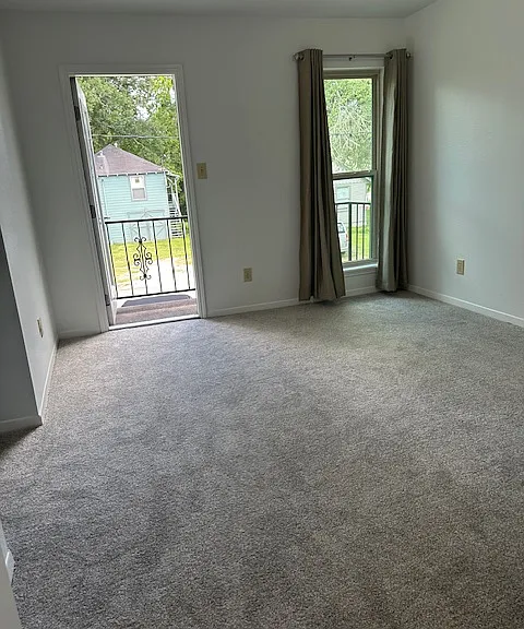 Primary bedroom with balcony