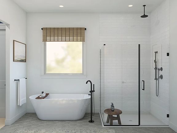 Primary bath with freestanding tub glass-shower enclosure