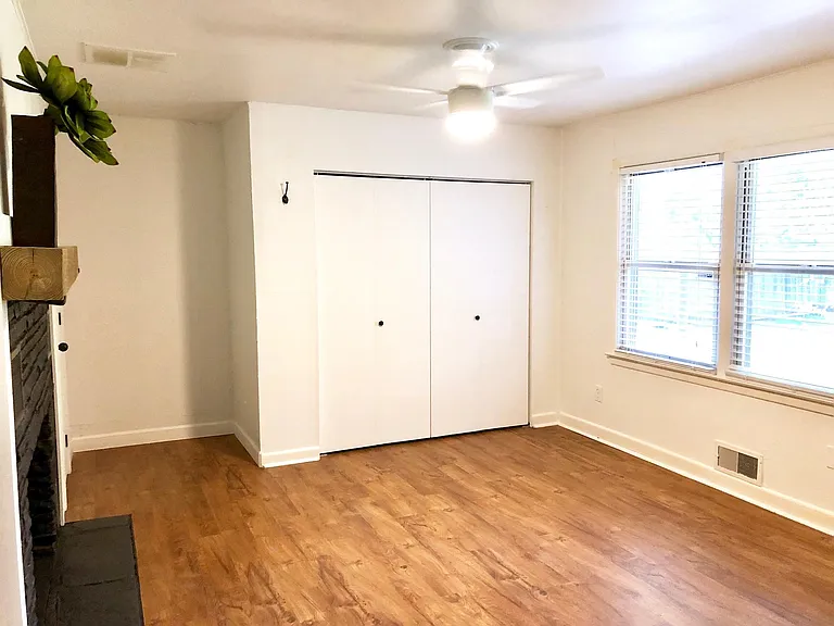 Master Bedroom (#3) with fireplace, double closet, single closet & window blinds. Fits a King or Queen bed. New modern ceiling fan with LED light with dimmer and variable speed fan.