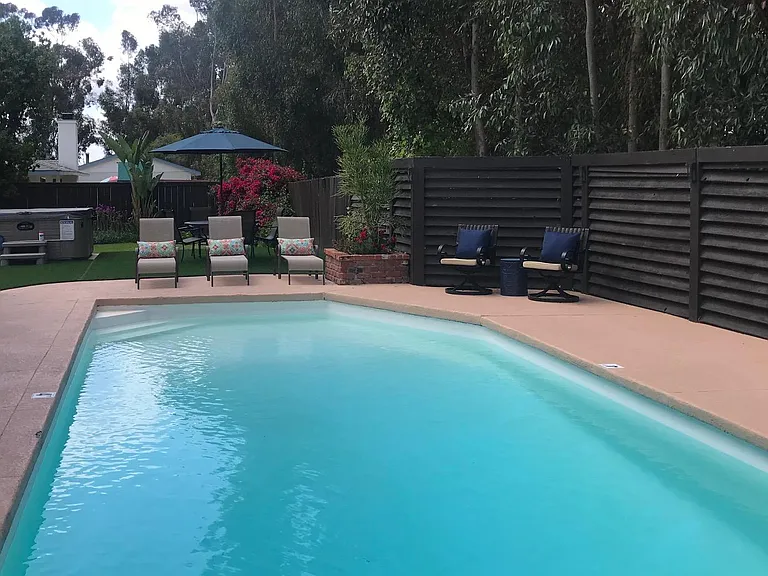 Large back yard with private pool and hot tu
