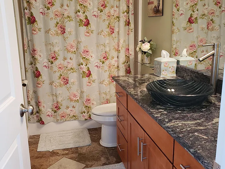 Upstairs full bath with tub adjoining the second bedroom