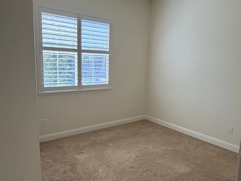 Guest bedroom facing front of home