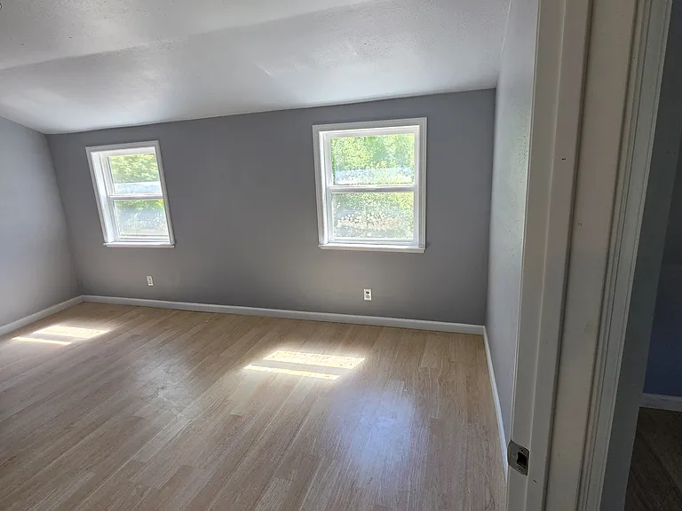 Upstairs primary bedroom (view from entry)