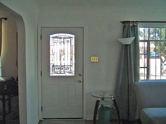 Front door leads to living room (on the right in photo) and dining room (left)