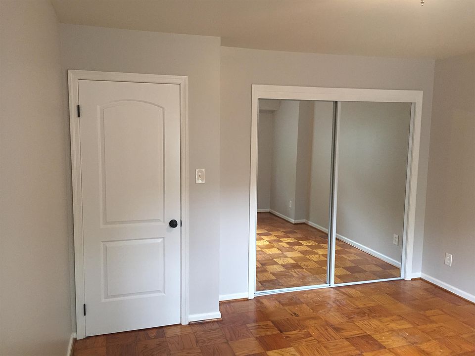 New mirror closet doors and new bedroom door with modern dar
