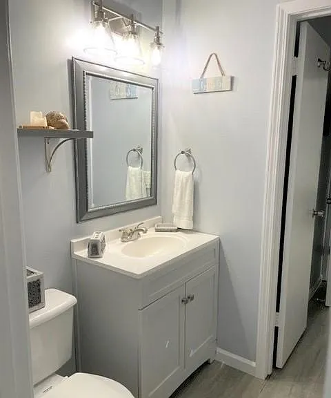 Full bath with newly installed gray tile shower and tub