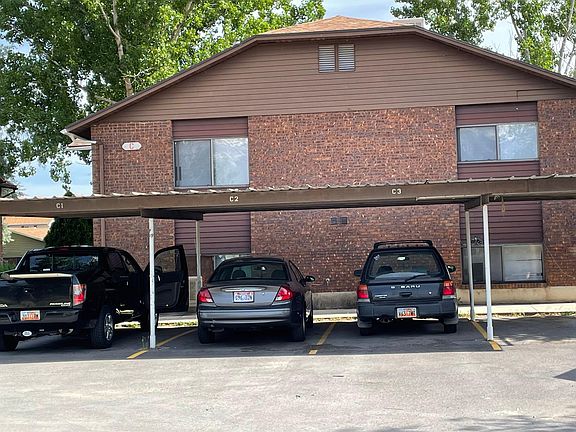 Covered parking space. One more parking space uncovered.