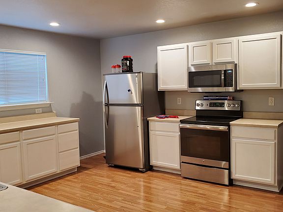 Spacious kitchen with ample storage and counter space.