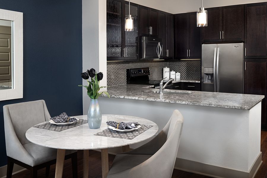 Gourmet kitchens feature granite or quartz finishes