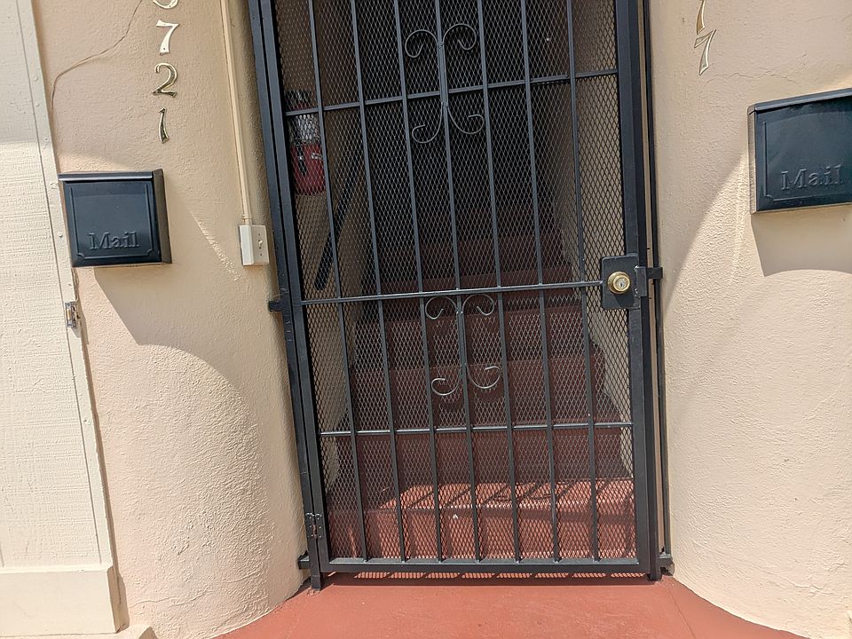 Front security gate stairs to landing and unit door.
Second unit across