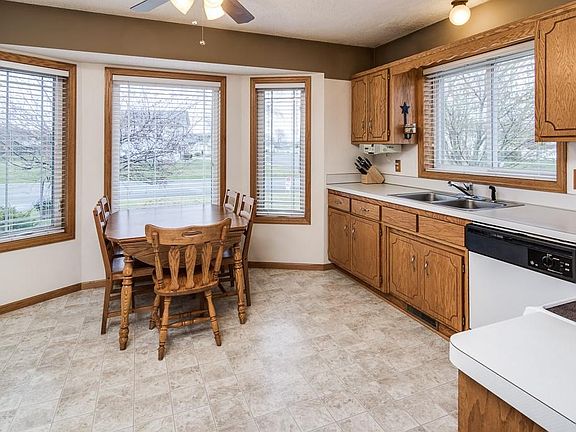 Front kitchen bay is perfect for breakfast table and updated windows all have 2â?? white blinds.