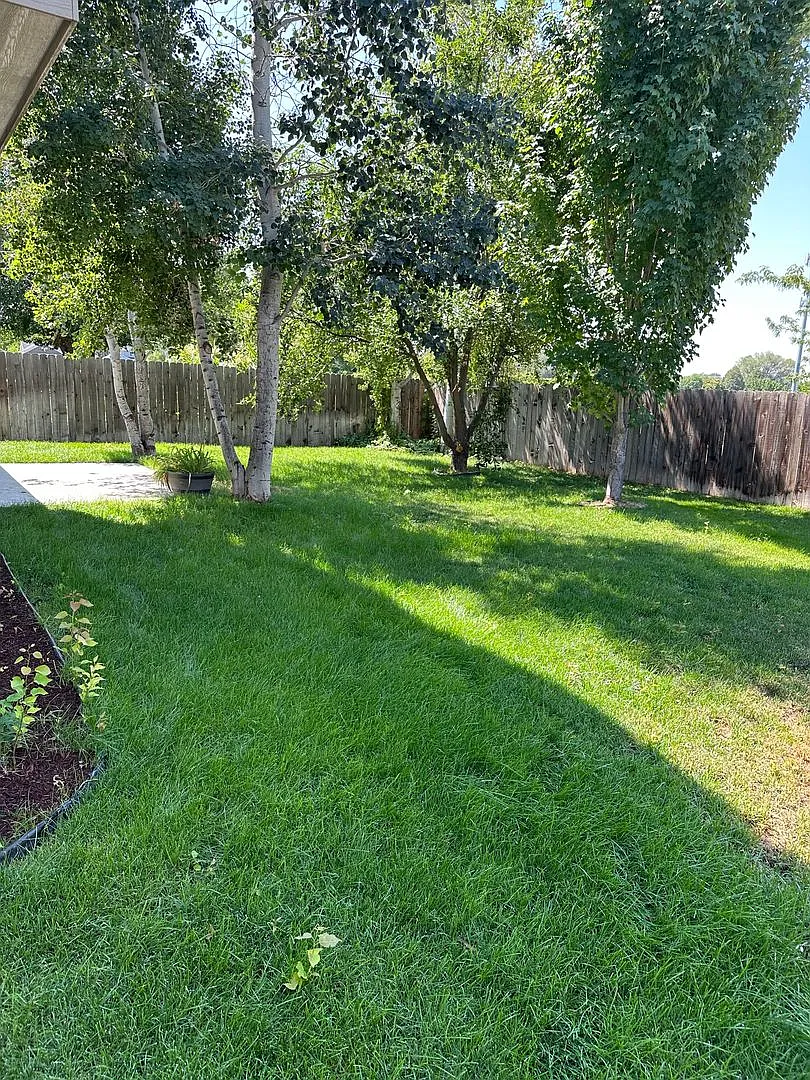 4-Bed Meridian Retreat Featuring Flexible Layout & Private Backyard — Photo 4
