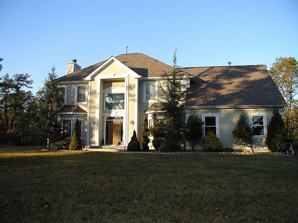 Magestic entrance is flanked by landscaping