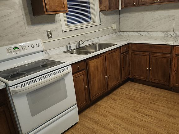 This is the kitchen, with new cabinets and floors recently installed.