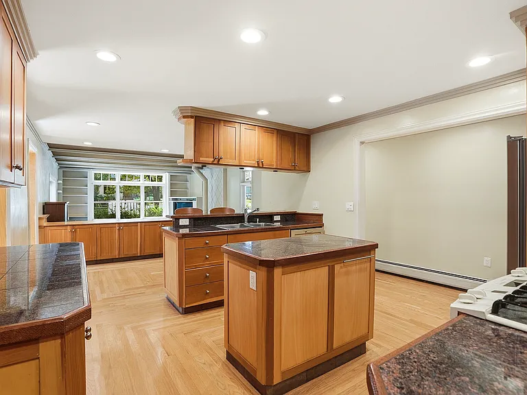 Generous counter space, thoughtful design, and views to the breakfast bar create a kitchen where the chef is always part of the conversation.