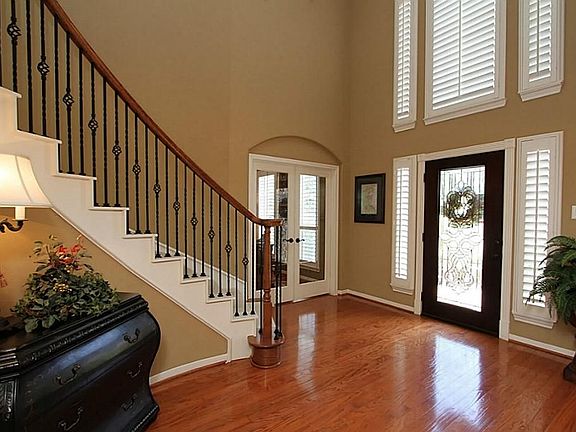 Gleaming Hardwood Floors will welcome your guests with a 2-story Entry
