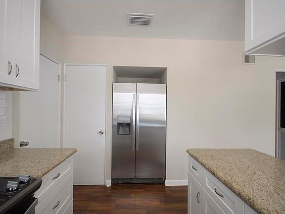 New Kitchen with Granite Counters and New Whirlpool Appliances.