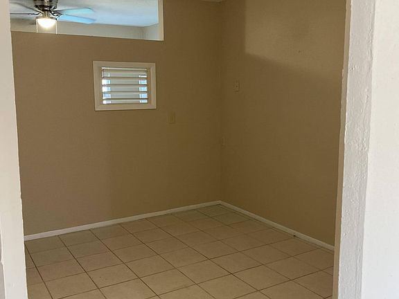 Middle area has ceiling fan and closet