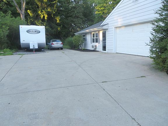 Garage and Parking with Extra Pad for Boat or Camper