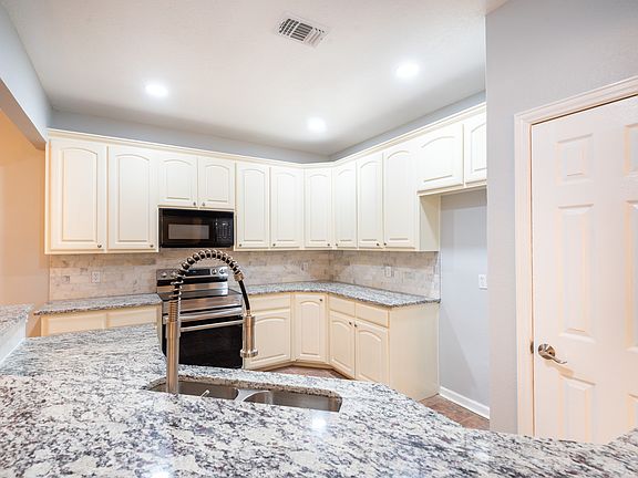 Beautiful kitchen with granite countertops.