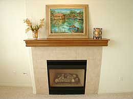 detail of fireplace with oak mantel