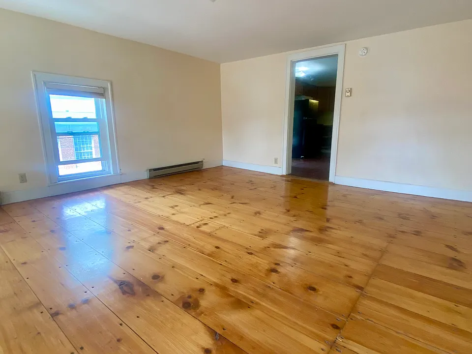 Living room with doorway into kitchen.