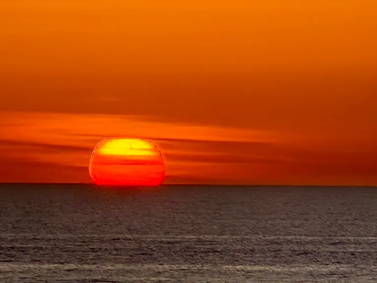 Setting sun view over the Pacific Ocean