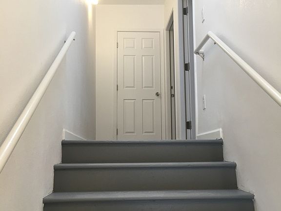 On the staircase entering the unit.
