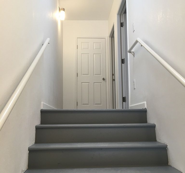 On the staircase entering the unit.