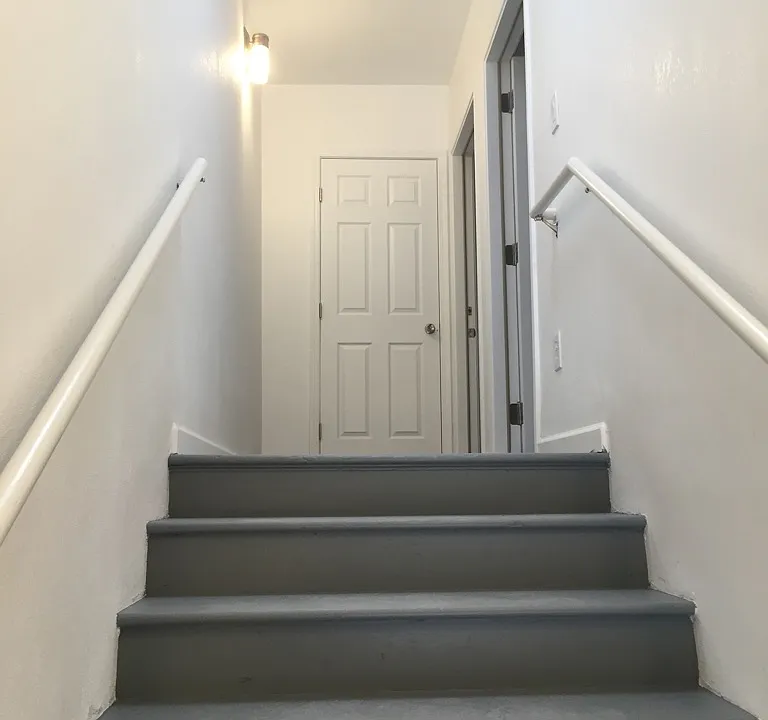 On the staircase entering the unit.