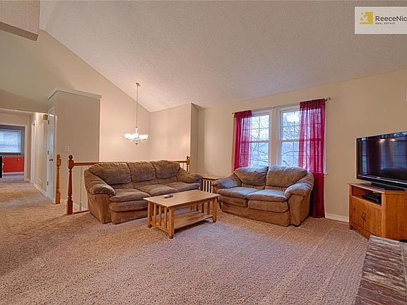 Open family room plan, vaulted ceiling. Brick fireplace w/gas line for gas logs.