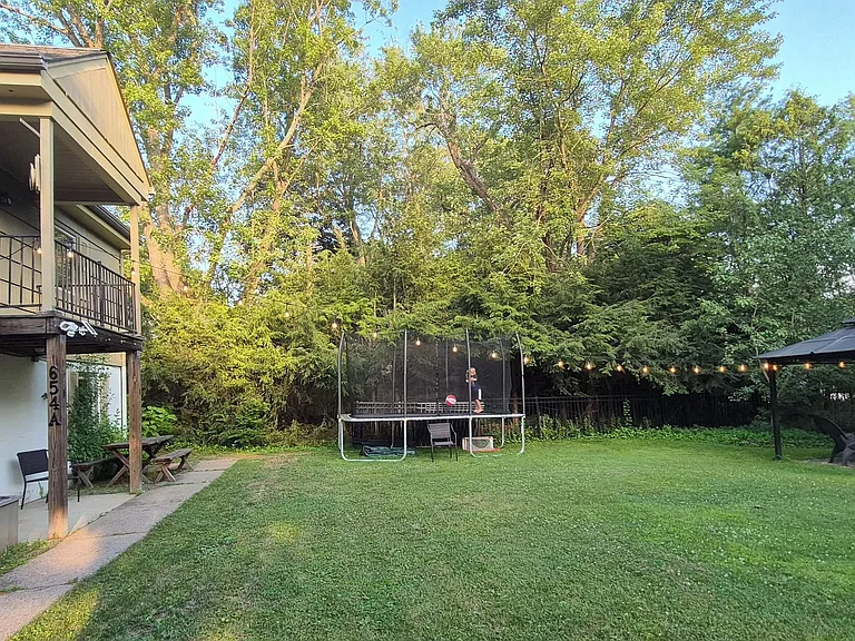 Shared backyard has a pavilion with propane firepit that you can use. Our kids' trampoline is back there too, and they use it a lot!