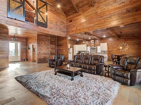 Stunning is an understatement as you enter the PINE open concept entry, 26' high family room and eat-in kitchen with wood beams,