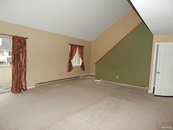 Neutral Carpeting & Cathedral Ceilings