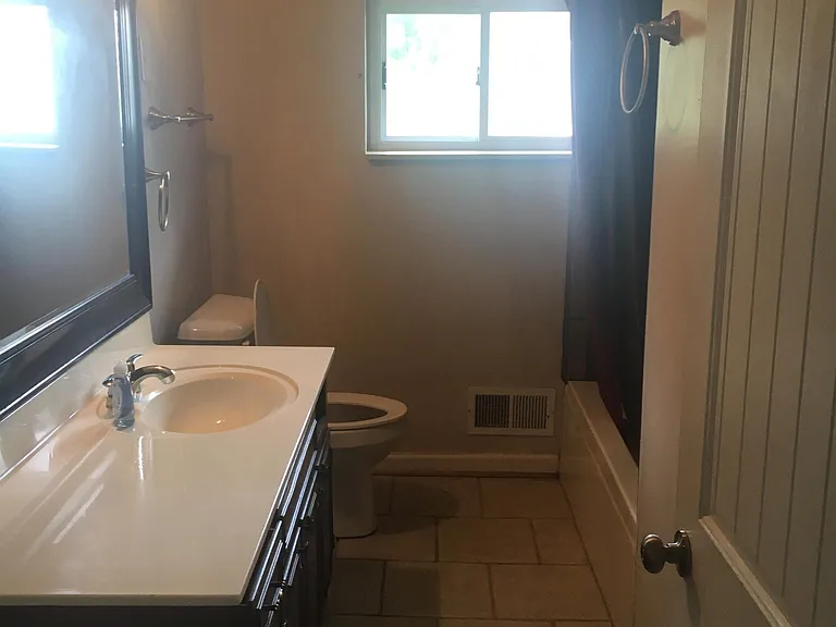 Bathroom in hall between bedrooms