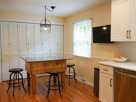 Enjoy dining in the kitchen with a genuine butcher block table.