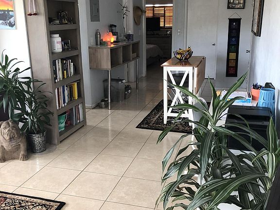 front door looking into dining room and bedroom. kitchen and